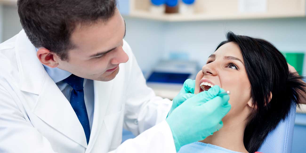 Doctor is Checking Patient's Mouth